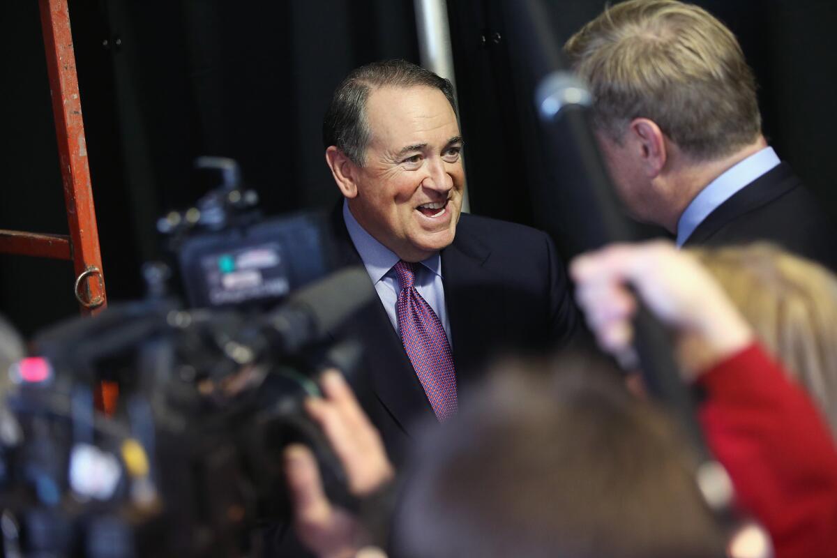 Former Arkansas Gov. Mike Huckabee, shown here on March 7 in Iowa, spoke Saturday at the Nixon Presidential Library in Yorba Linda.