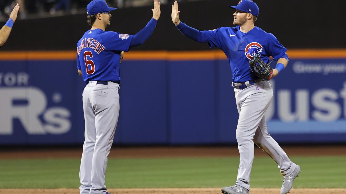 Cubs pitcher Adrian Sampson exchanges words with Mets' Pete Alonso