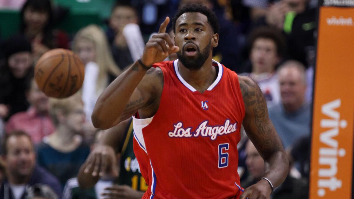 Clippers center DeAndre Jordan celebrates after a dunk during the 112-96 win over the Utah Jazz on Nov. 29, 2014.