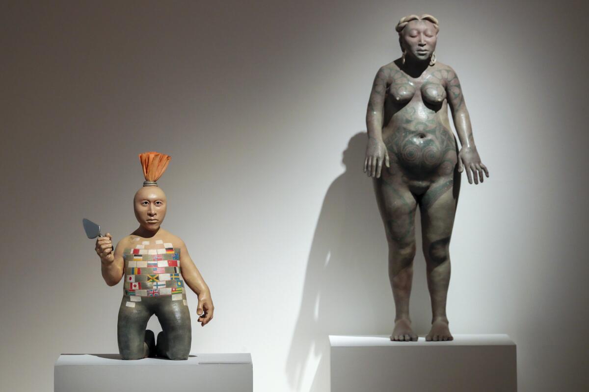 Roxanne Swentzell sculptures "Trump, Trump," left, 2017, clay; and "Tatooed Woman," 1989, clay, at Scripps.