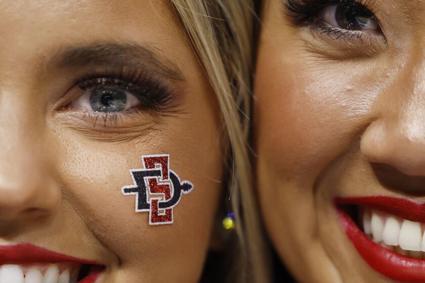 Orlando, FL - March 16: San Diego State cheerleaders looks on after a win against the College of Charleston in the first round of the NCAA Tournament in Orlando on Thursday, March 16, 2023.. (K.C. Alfred / The San Diego Union-Tribune)