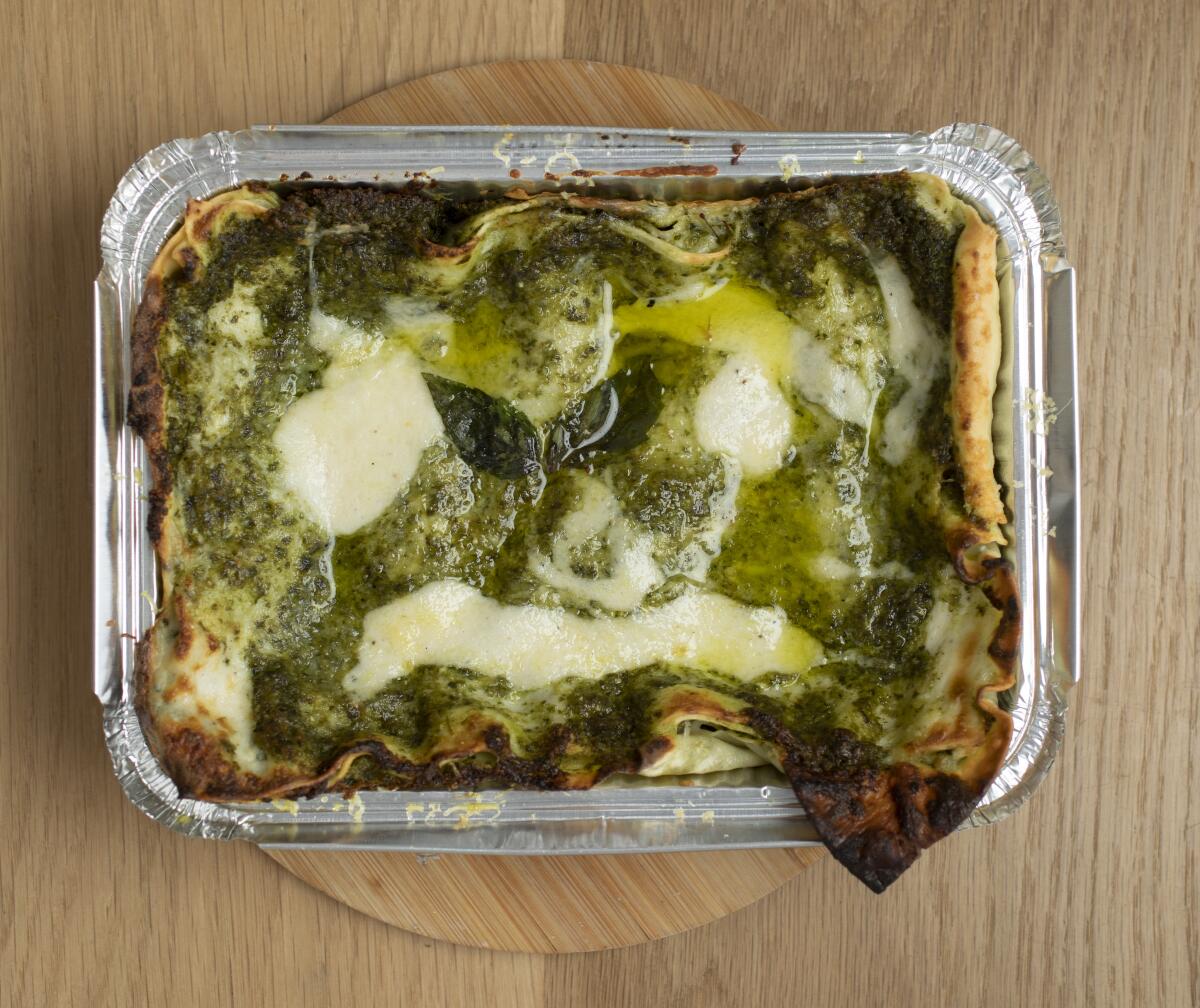 Pesto lasagna in a foil pan.