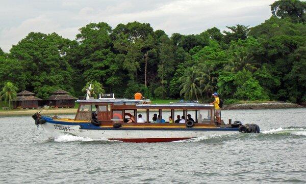 A bumboat makes its way to Pulau Ubin, Singapore. The island is one of the few places in the city-state where nature runs unfettered. About 20% of the vegetation there is mangrove forest, and there's also Singapore's only off-road biking course.