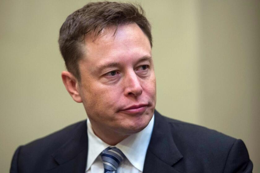 (FILES) In this file photo taken on January 23, 2017 CEO Elon Musk listens to US President Donald Trump speak during a meeting with business leaders in the Roosevelt Room at the White House in Washington, DC. - Tesla Motors dropped in early trading on August 20, 2018 due to rising doubts about Chief Executive Elon Musk's plans to take the electric carmaker private. Shares fell 2.6 percent to $297.55 about 20 minutes into trading, continuing the company's downward trajectory after Musk surprised markets on August 7 by announcing on Twitter he wanted to take Tesla private. (Photo by NICHOLAS KAMM / AFP)NICHOLAS KAMM/AFP/Getty Images ** OUTS - ELSENT, FPG, CM - OUTS * NM, PH, VA if sourced by CT, LA or MoD **