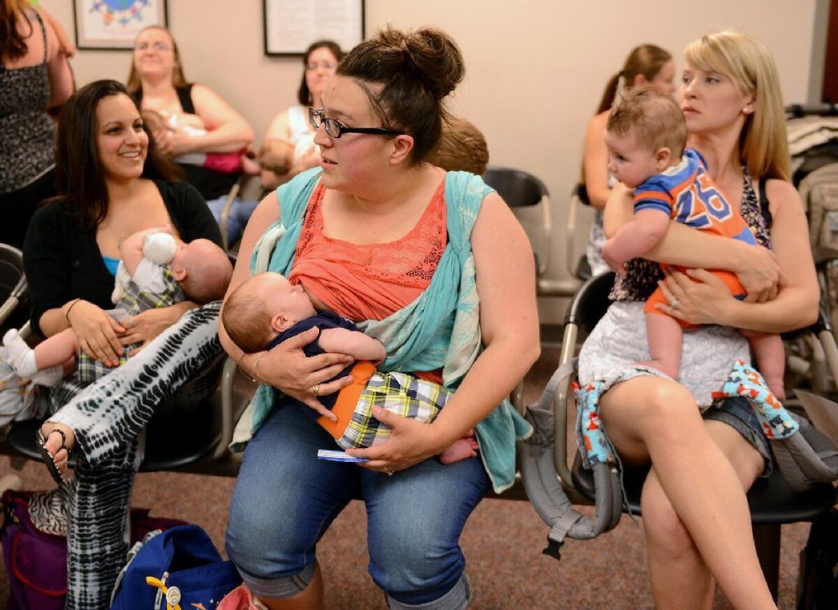 Mothers nurse their babies in Lansing, Mich. A new study finds that children who were breast-fed for any amount of time were less likely to develop leukemia than children who never nursed.