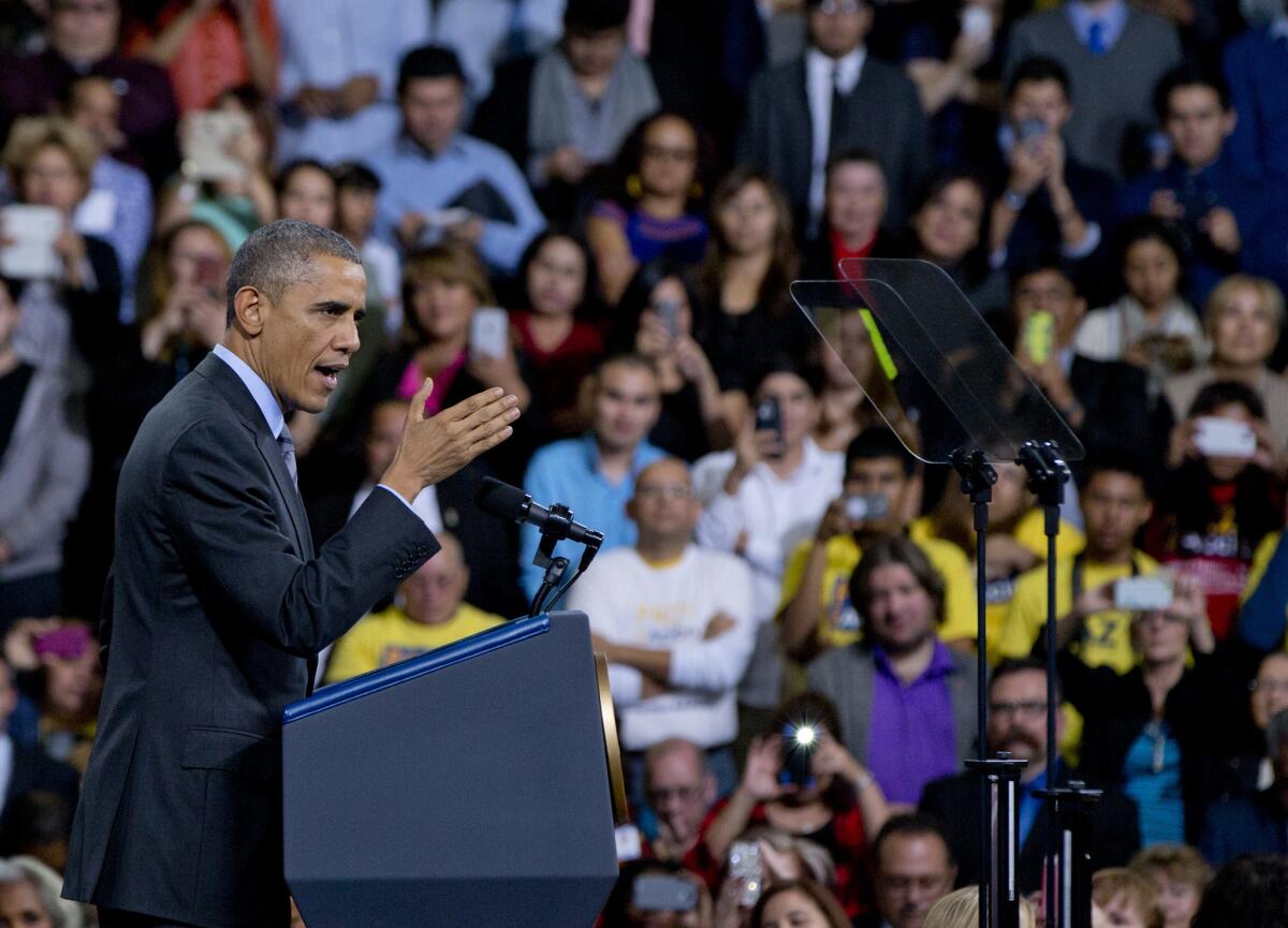 President Obama speaks about immigration at Del Sol High School, in Las Vegas, on Friday. His announcement of new rules limiting deportations has drawn strong support from Latinos, according to a new poll.