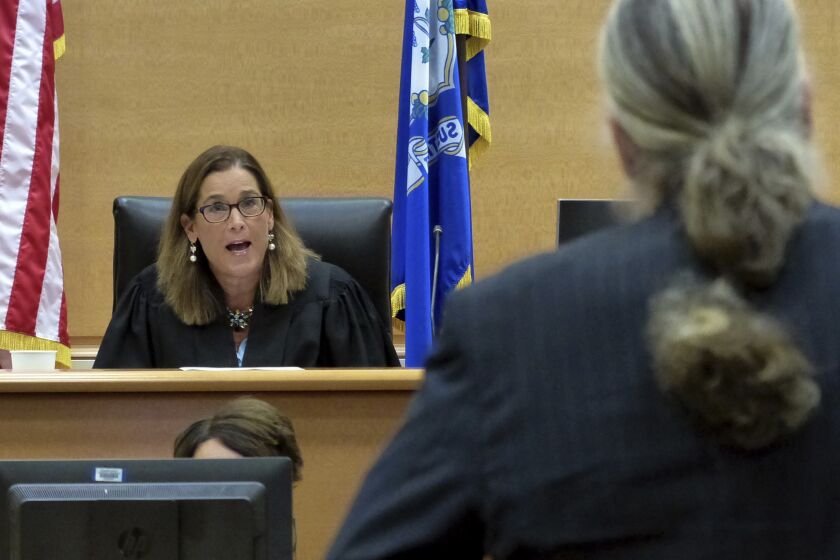 Alex Jones' attorney Norm Pattis, right, is warned by Judge Barbara Bellis to not speak over her during Jones' Sandy Hook defamation damages trial at Connecticut Superior Court in Waterbury, Conn., Friday, Sept. 23, 2022. (Christian Abraham/Hearst Connecticut Media via AP, Pool)