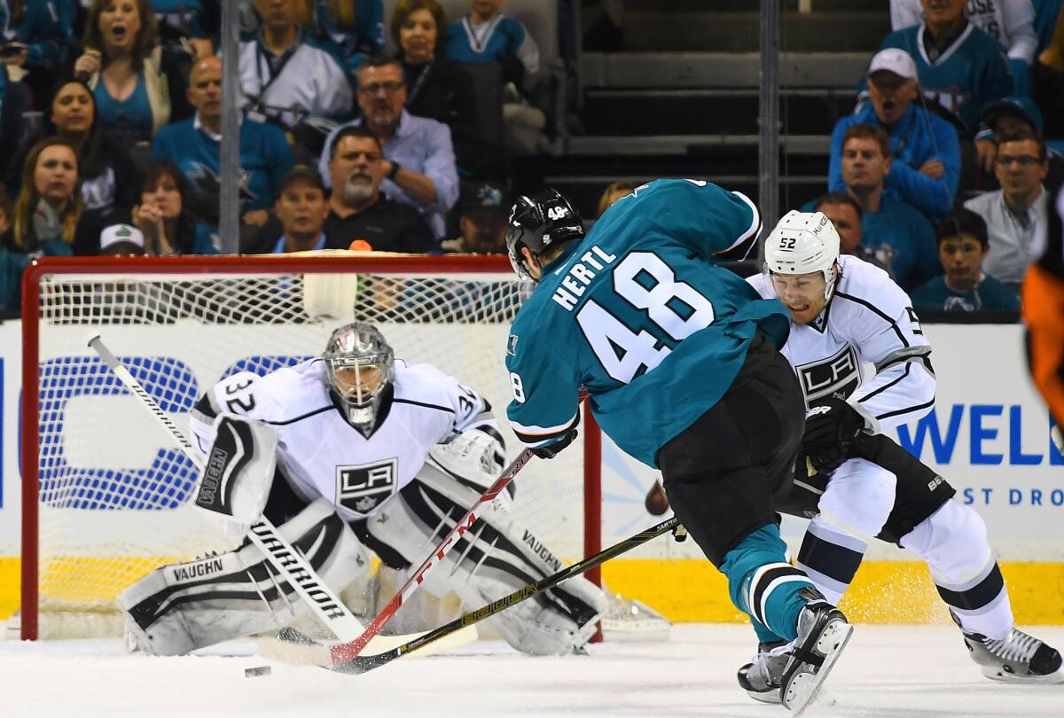 Kings goalie Jonathan Quick (32) defends a shot by Sharks center Tomas Hertl (48) in the first period of Game 3.