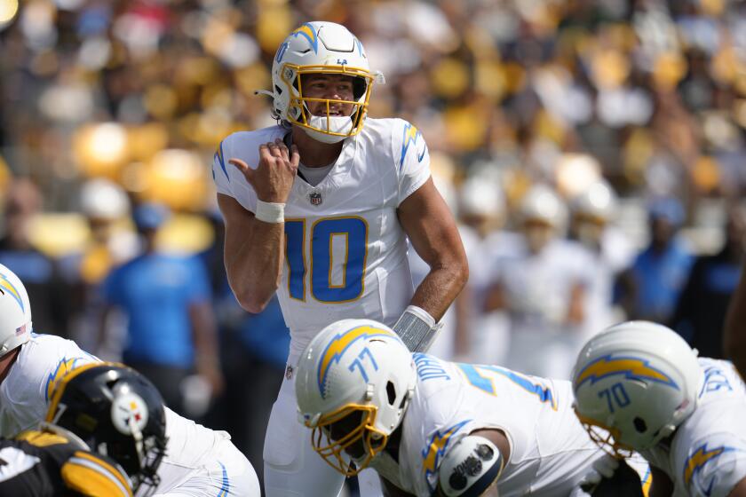 Los Angeles Chargers quarterback Justin Herbert (10) calls signals during an NFL football game against the Pittsburgh Steelers in Pittsburgh, Sunday, Sept. 22, 2024. (AP Photo/Gene J. Puskar)