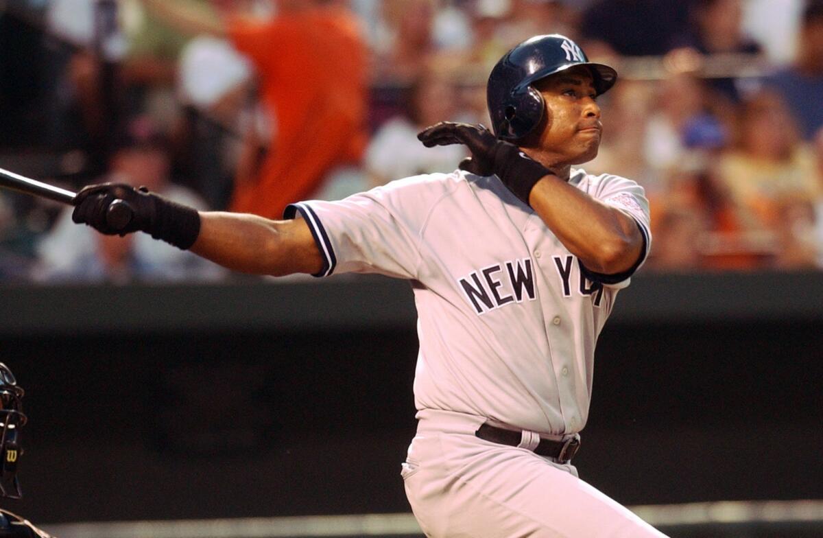 Story Slug: ALrdp16.ART New York Yankees Bernie Williams follows through on his two run home run in the third inning against the Baltimore Orioles, Friday, Aug. 15, 2003 at Camden Yards in Baltimore. (AP Photo/Gail Burton) ORG XMIT: BAB101