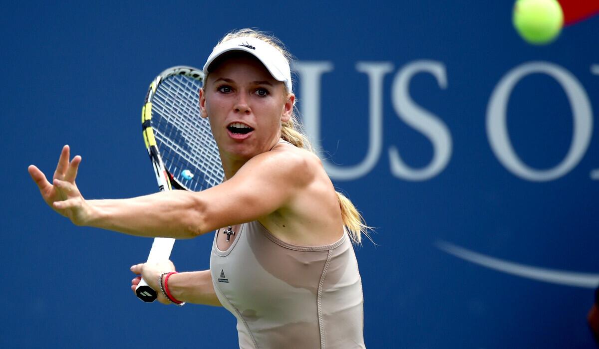 Caroline Wozniacki prepares to hit a forehand during her victory over Maria Sharapova on Sunday.