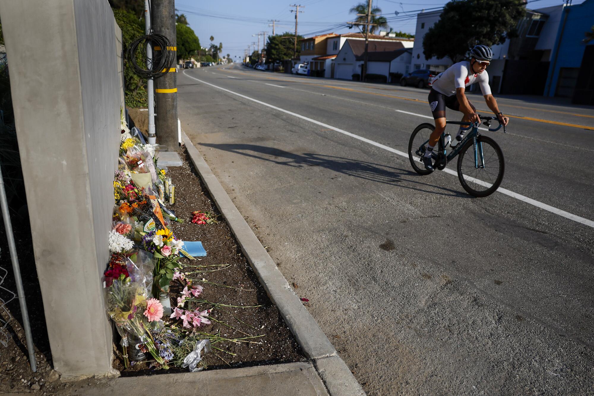 Flowers at the 21600 block of Pacific Coast Highway near the site where four Pepperdine students were killed by a passing car