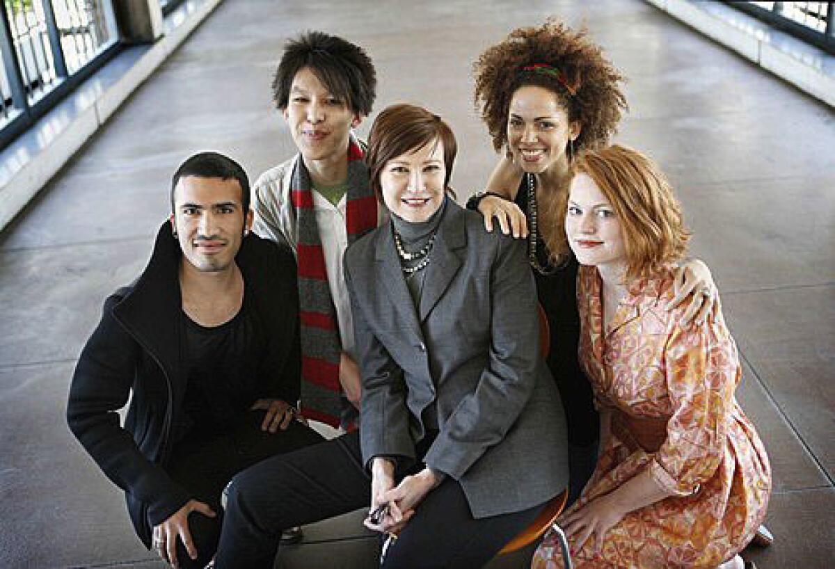 MOST PROMISING STUDENTS: Rosemary Brantley, chair of the fashion department, is surrounded by Jorge Munoz, left, Davy Yang, Nicole Guice and Ila Erickson.