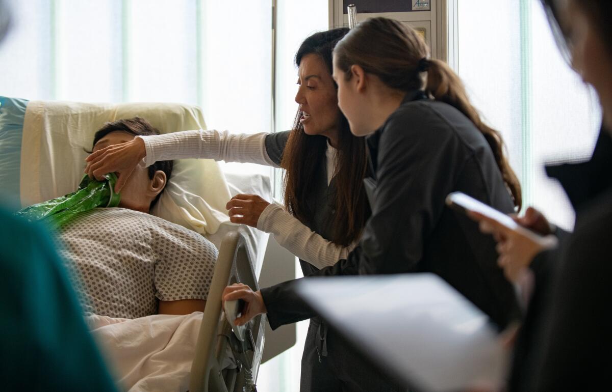 Instructor Ju-An Broyles trains second-year nursing students at Golden West College.