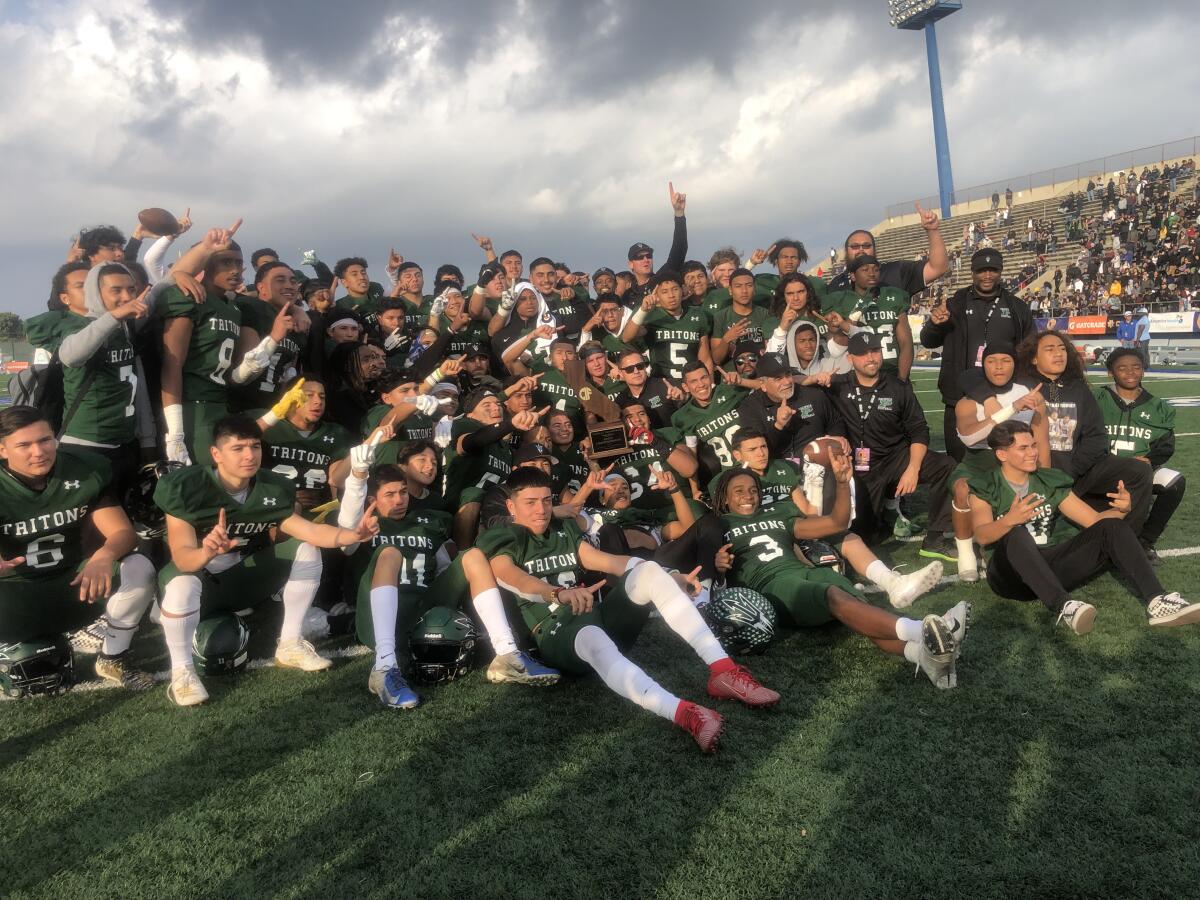 Oxnard Pacifica players celebrate winning the CIF state Division 2-A bowl game on Saturday at Cerritos College with a 34-6 win over Oakland McClymonds.