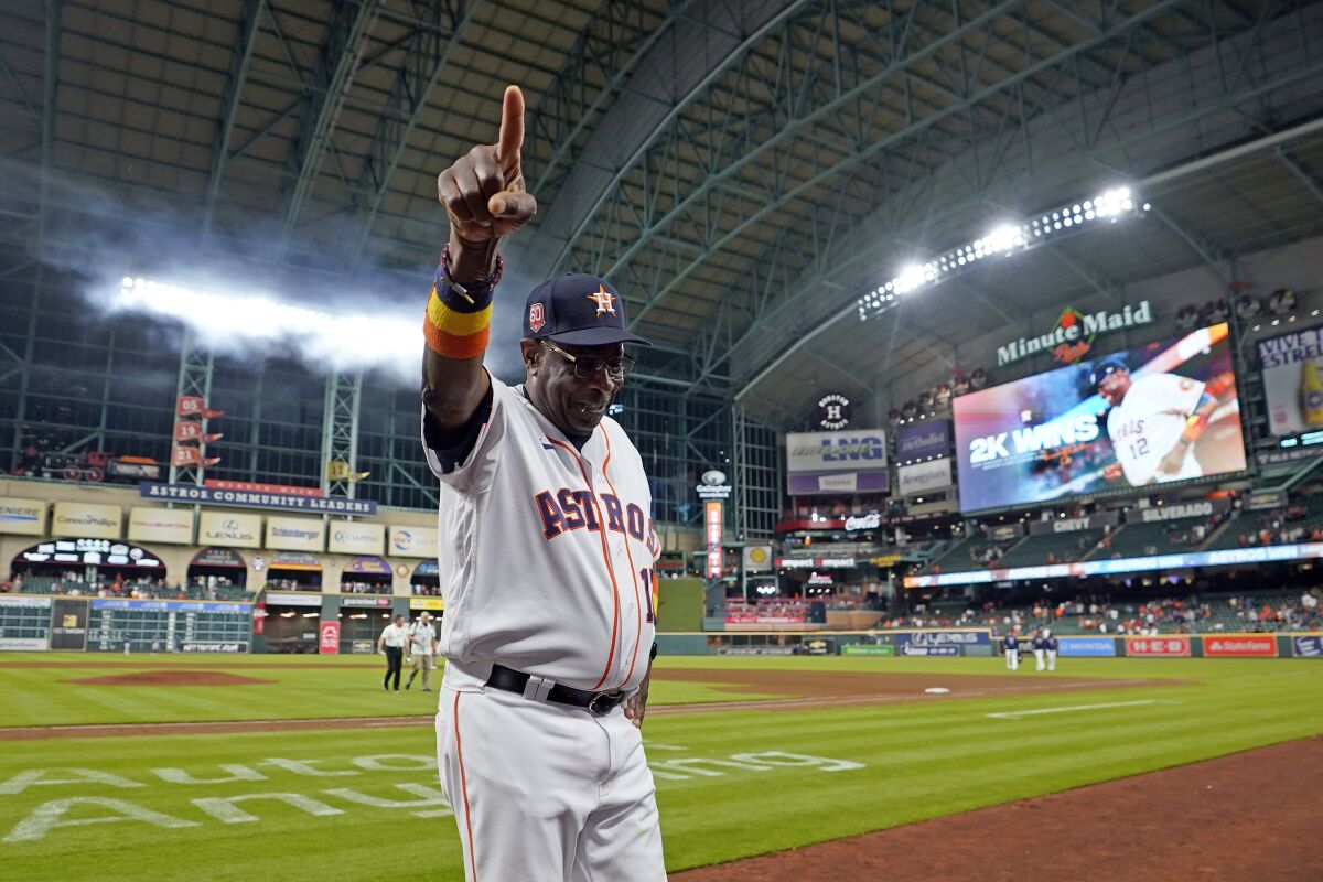 Houston Astros manager Dusty Baker Jr. celebrates after a baseball game against the Seattle Mariners Tuesday, May 3, 2022, in Houston. The Astros won 4-0 giving Baker 2,000 career wins. (AP Photo/David J. Phillip)