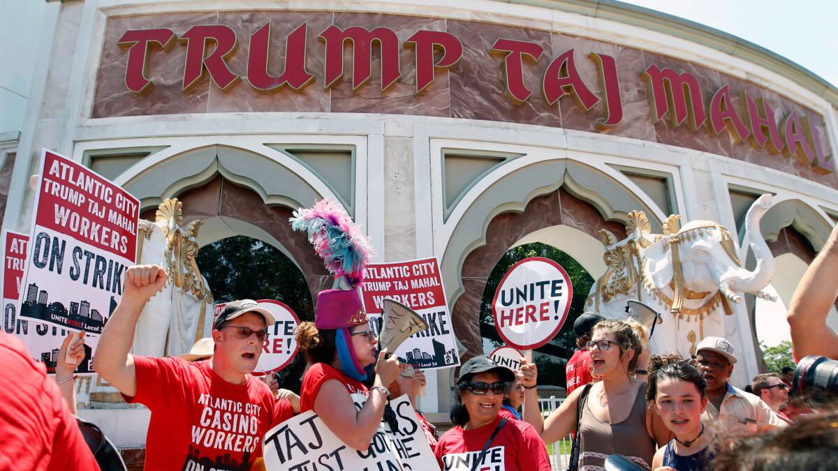Striking workers picket outside the Trump Taj Mahal hotel and casino in Atlantic City, N.J. on July 6.