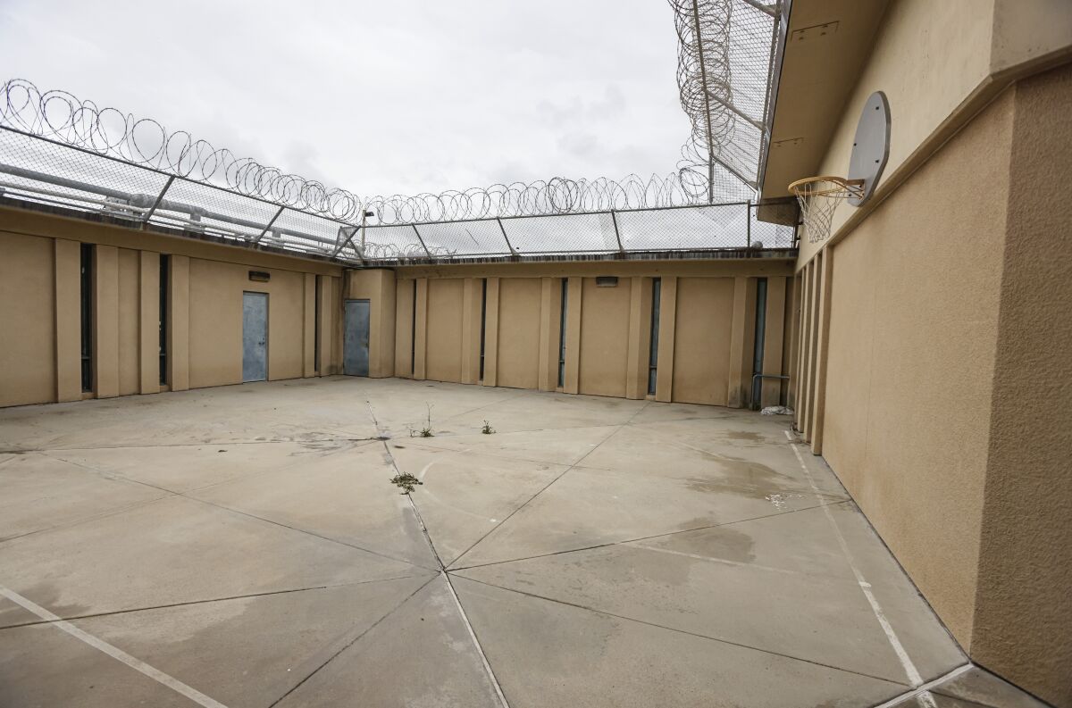his is an interior quad, lined with razor wire, with basketball hoop (right) at the old Juvenile Detention facility