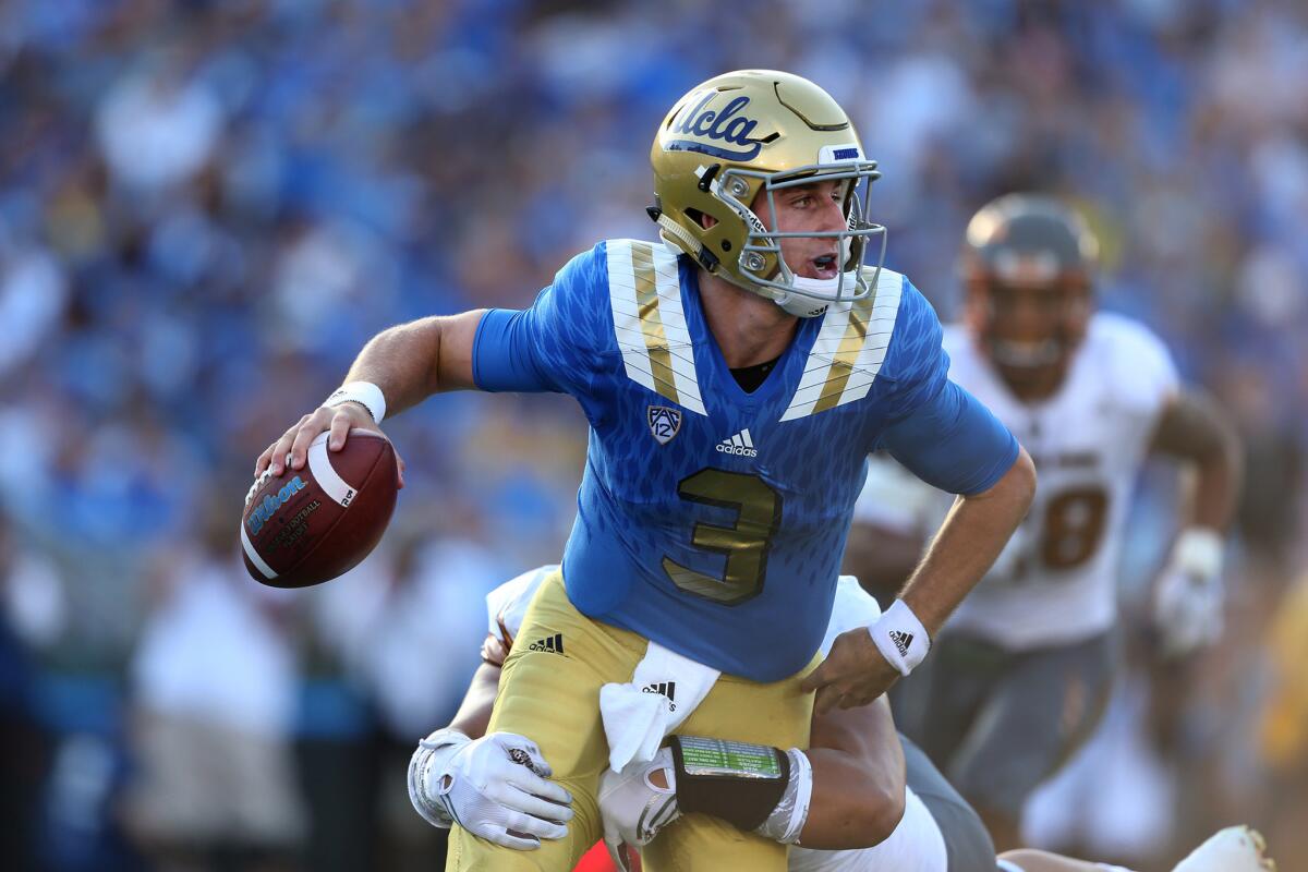 UCLA quarterback Josh Rosen is sacked for a safety by ASU defensive lineman Viliami Latu during first quarter action at the Rose Bowl on Oct. 3.