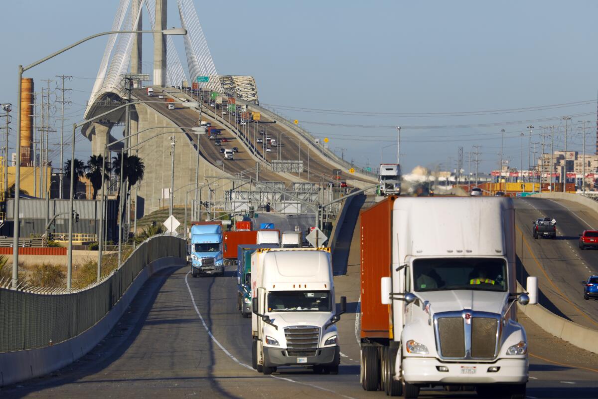 Trucks move across Terminal Island through the ports of Los Angeles and Long Beach.