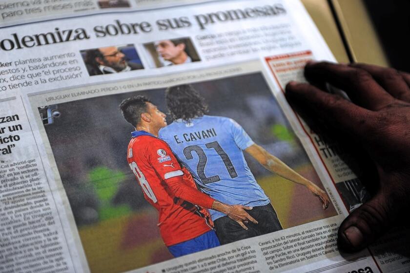 The front page of an Uruguayan newspaper shows on June 25, 2015 in Montevideo a picture of Chile's football team defender Gonzalo Jara provoking Uruguay's Edinson Cavani during their Copa America 2015 quarterfinals football match in Santiago. Cavani was sent off midway through the second half after receiving a second yellow card for flicking a hand into the face of Jara. AFP PHOTO/MIGUEL ROJOMIGUEL ROJO/AFP/Getty Images ** OUTS - ELSENT, FPG - OUTS * NM, PH, VA if sourced by CT, LA or MoD **