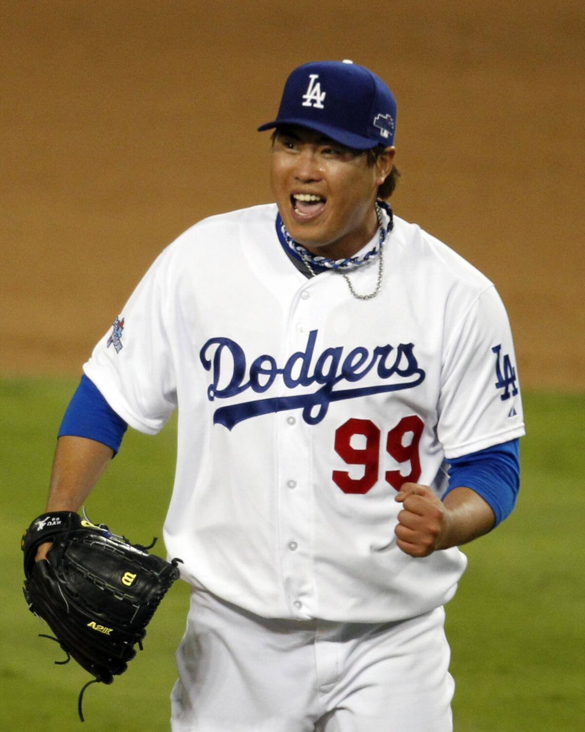 Dodgers starter Hyun-Jin Ryu celebrates his final strikeout during the seventh inning of the Dodgers' 3-0 victory over the St. Louis Cardinals in Game 3 of the National League Championship Series on Monday.