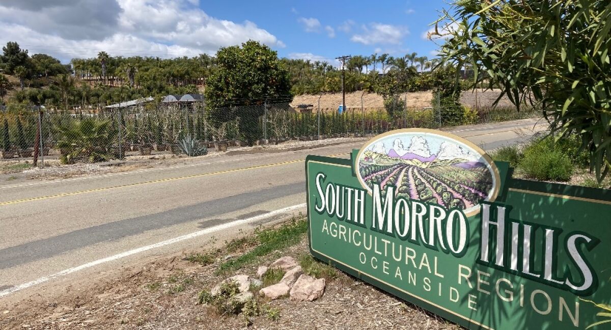 The entrance to South Morro Hills at Sleeping Indian Road and North River Road.