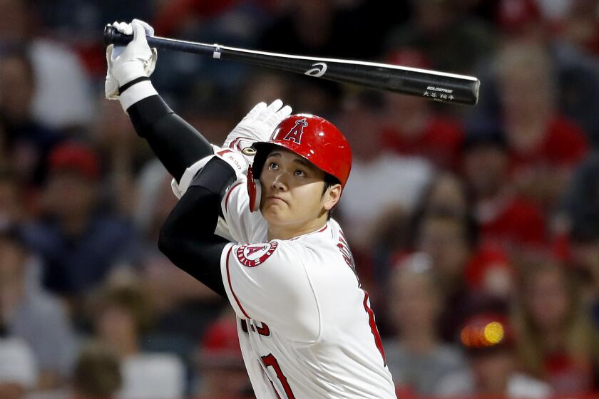 ANAHEIM, CALIF. - AUG. 13, 2019. Angels designated hitter Shohei Ohtani strokes a triple against the Pirates in the second inning Tuesday, Aug. 13, 2019, at Angels Stadium in Anaheim. (Luis Sinco/Los Angeles Times)