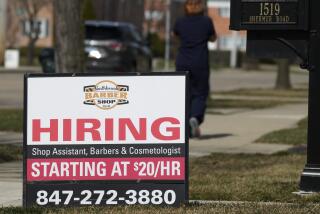 Un anuncio de contratación es exhibido afuera de una barbería en Northbrook, Illinois, el martes 12 de marzo de 2024. (AP Foto/Nam Y. Huh)