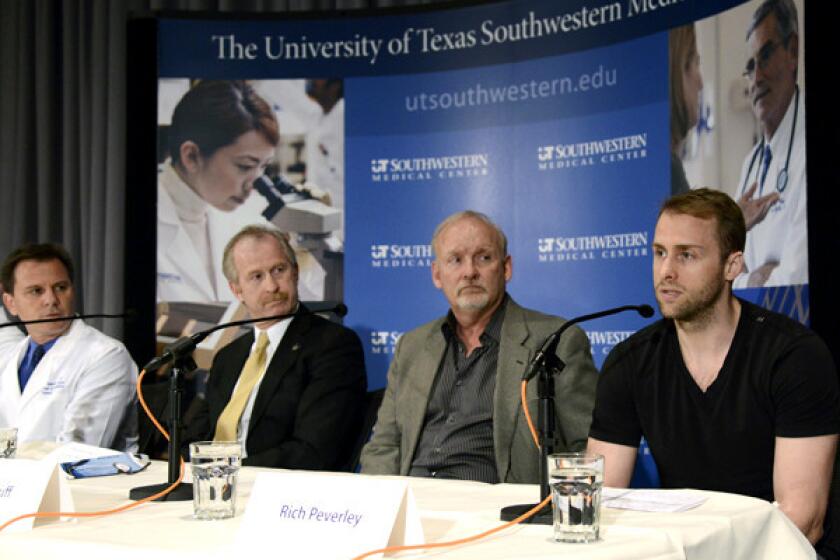 Dallas Stars forward Rich Peverley, right, discusses his irregular heartbeat during a news conference at Texas Southwestern Medical Center last week.