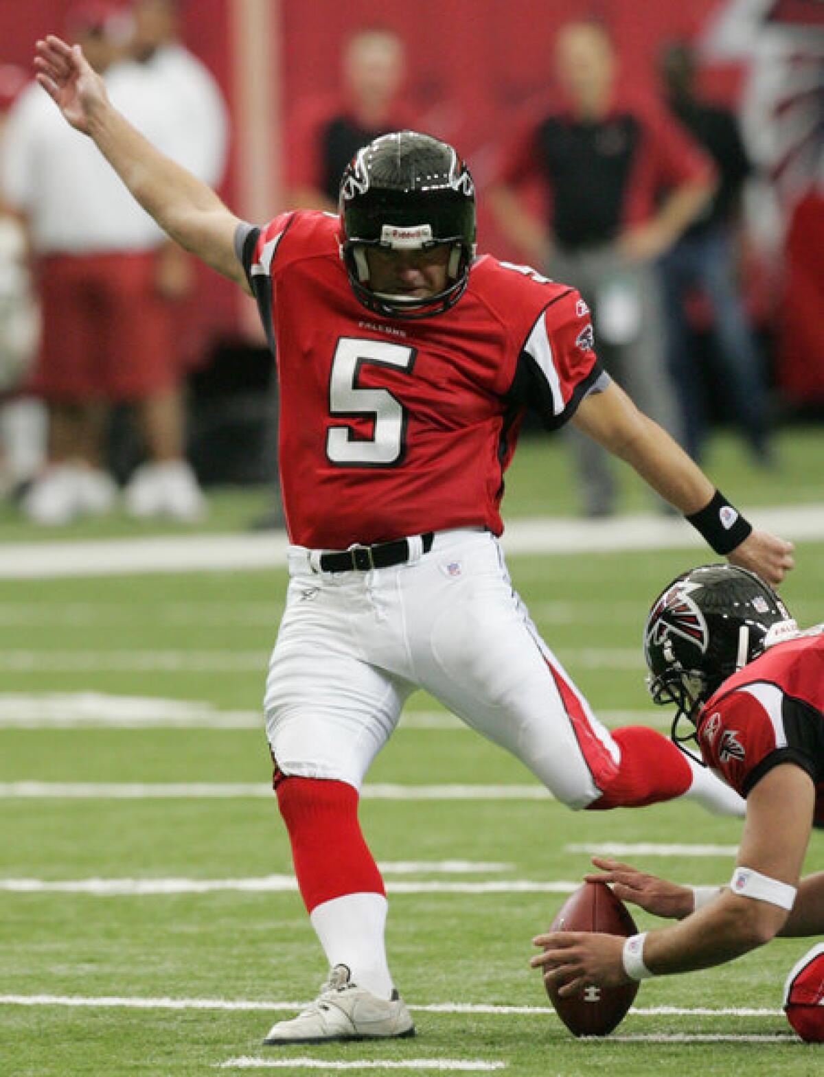 Atlanta Falcons kicker Morten Anderson kicks a field goal in 2006. The longtime placekicker is one of 64 kickers and punters to file workers' comp claims in California alleging head or brain trauma. (AP Photo/Ric Feld)