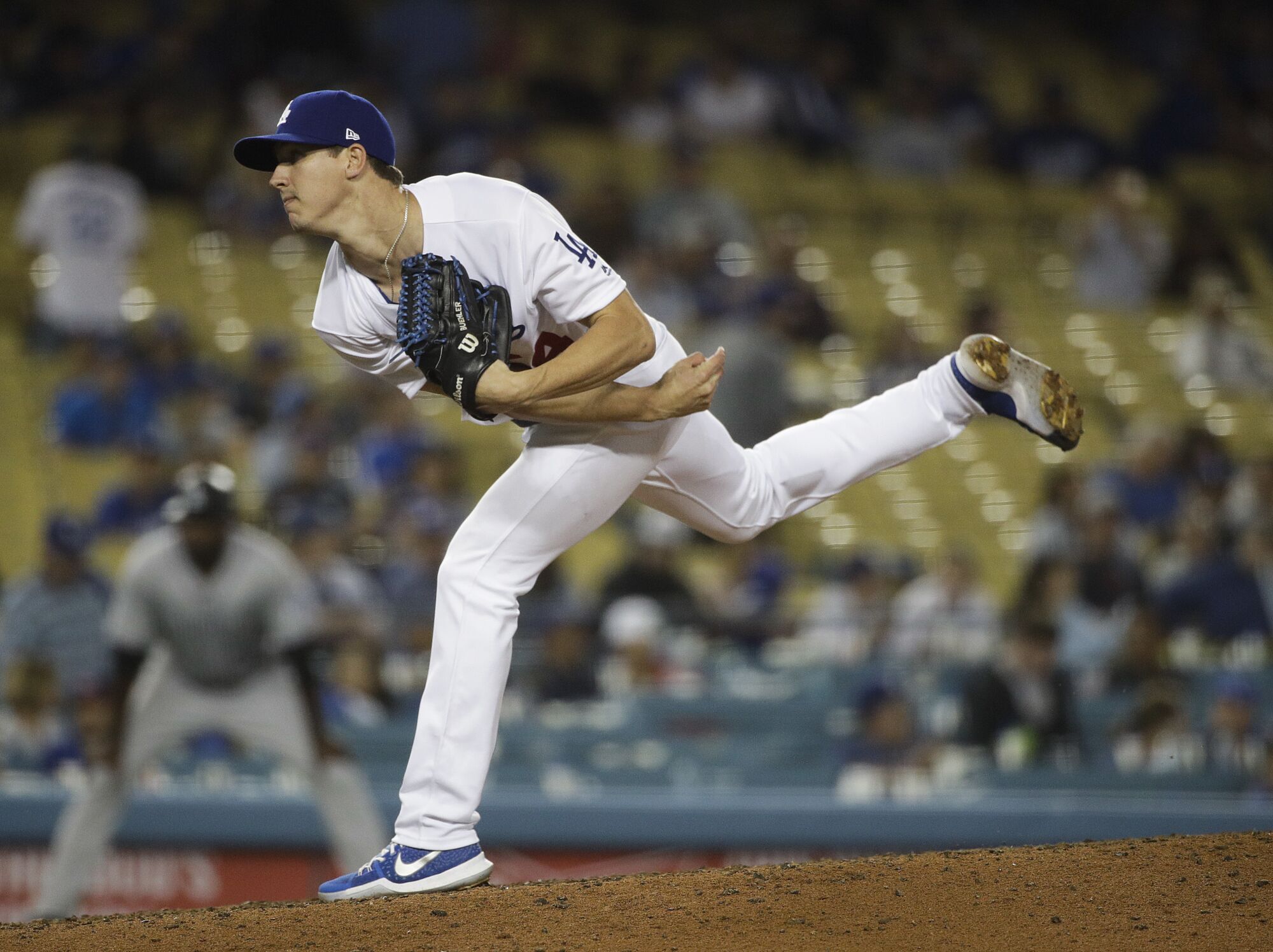 Walker Buehler releases a pitch against the Colorado Rockies on Sept. 7, 2017
