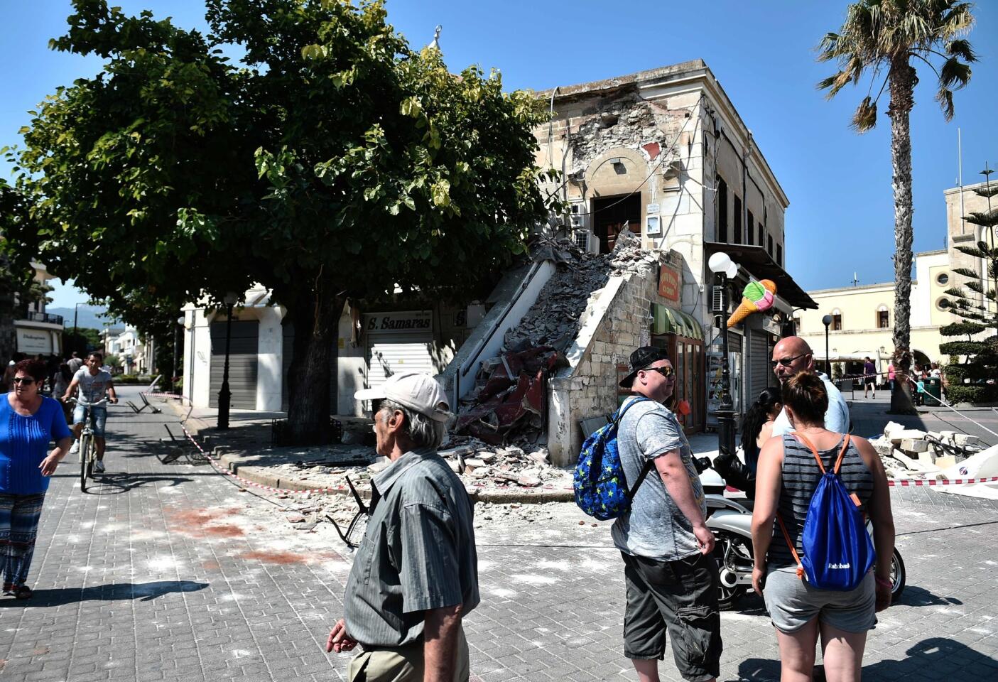 Tourists and residents on the Greek island of Kos find rubble-strewn streets and damaged buildings the morning after a strong earthquake struck the region.
