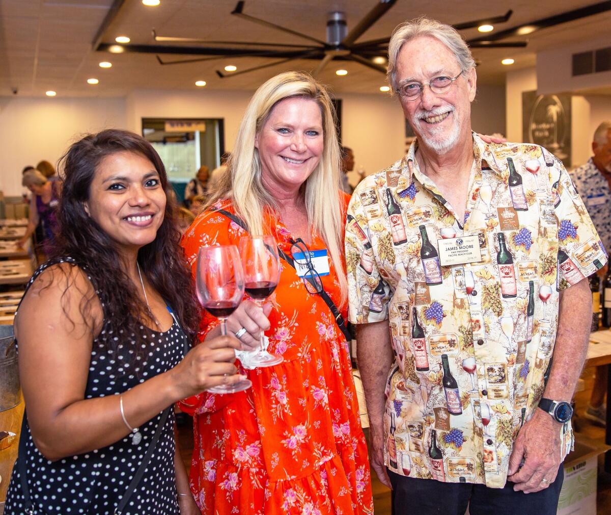 Nancy Vides, Vicki Majernik and "Wine-down Summer" chairman Jim Moore at the 2022 event.