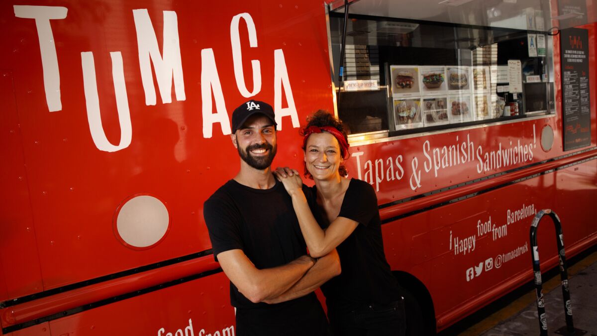 Husband and wife Victor and Sybil Roquin, with their Tumaca food truck.