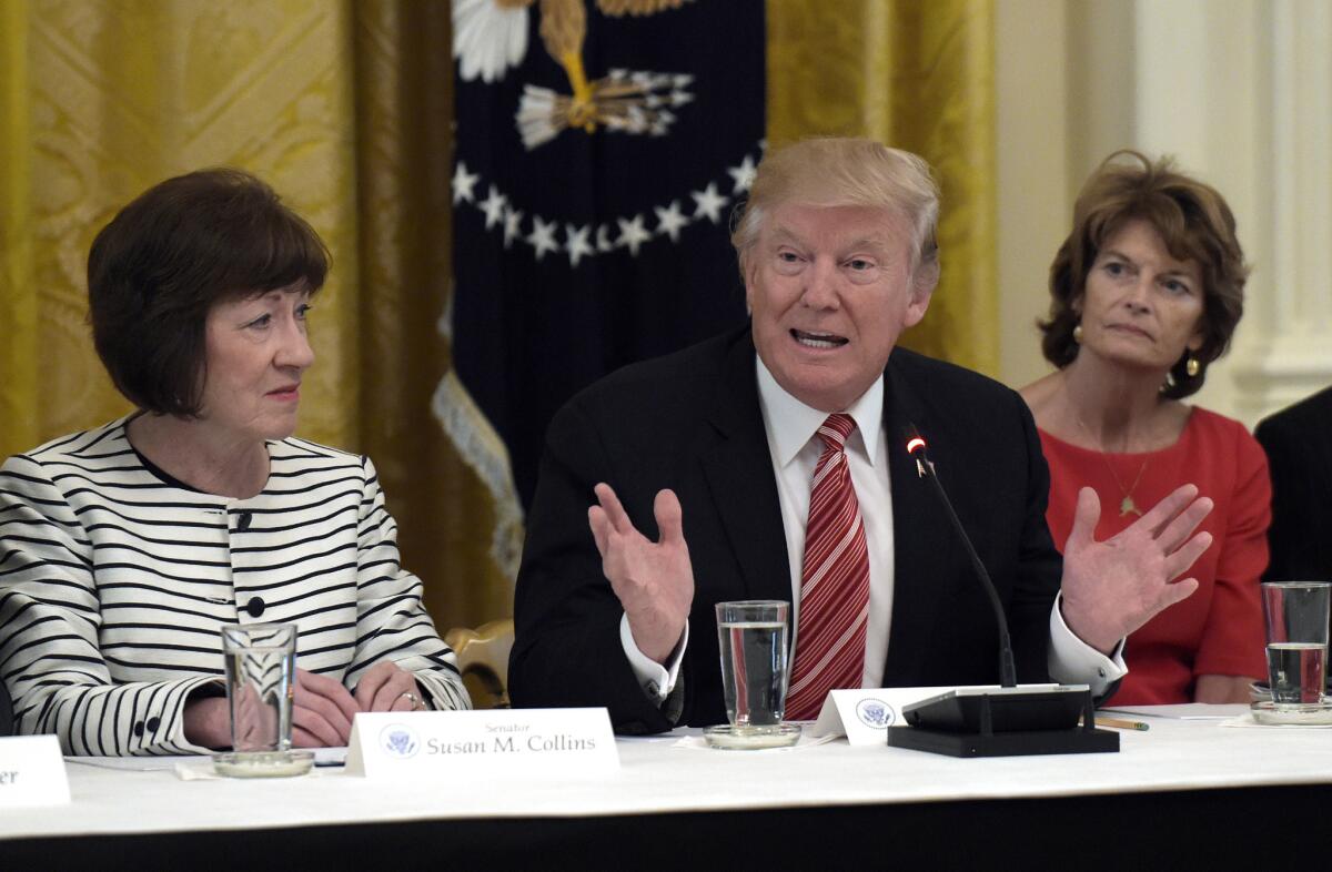President Trump meets with Republican Sens. Susan Collins (R-Maine), left, and Lisa Murkowski (R-Alaska).