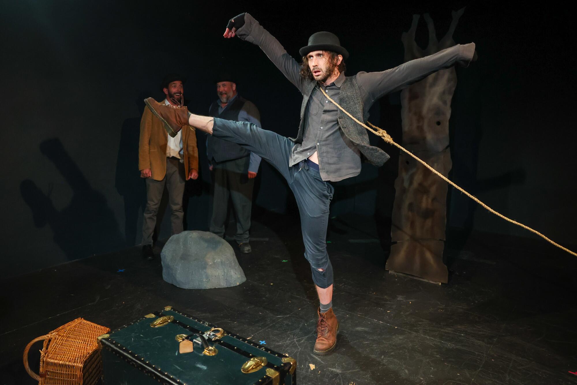 Three men onstage performing in a play.