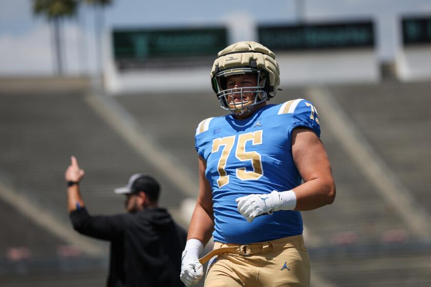 Pasadena, CA - April 27: Offensive lineman Bruno Fina #75 of the UCLA Bruins warms up during the UCLA football spring showcase at the Rose Bowl Stadium on Saturday, April 27, 2024 in Pasadena, CA.(Meg Oliphant / For the Times)