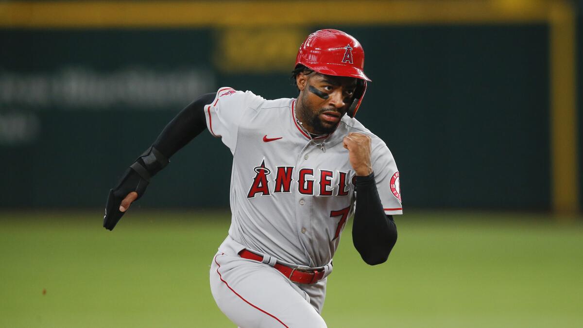 Angels' Jo Adell (7) runs to third during a baseball game against the Texas Rangers