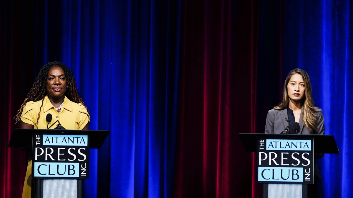 FILE - Former state Rep. Dee Dawkins-Haigler, left, and Georgia State Rep. Bee Nguyen, right, participate in Georgia's secretary of state democratic primary election runoff debates, June 6, 2022, in Atlanta. (AP Photo/Brynn Anderson, File)