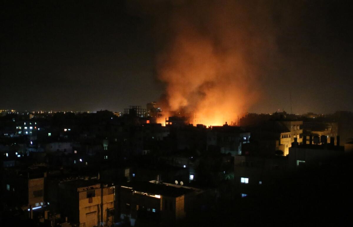 Smoke rises from a shopping center after an Israeli airstrike in the southern Gaza Strip town of Rafah.