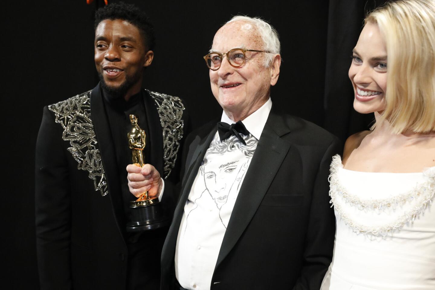 James Ivory with presenters Chadwick Boseman, left, and Margot Robbie after winning for adapted screenplay for "Call Me by Your Name" backstage at the 90th Academy Awards on Sunday at the Dolby Theatre in Hollywood.