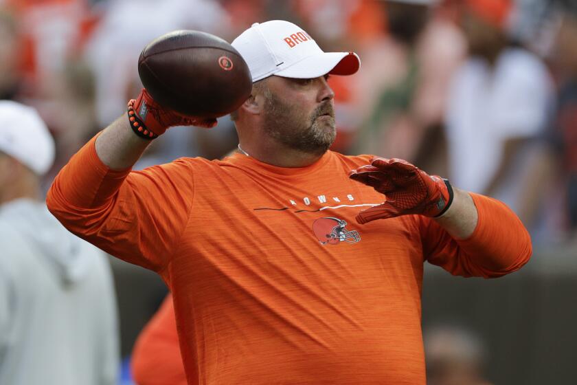 Cleveland Browns head coach Freddie Kitchens throws a football before an NFL preseason football game between the Washington Redskins and the Cleveland Browns, Thursday, Aug. 8, 2019, in Cleveland. (AP Photo/Ron Schwane)