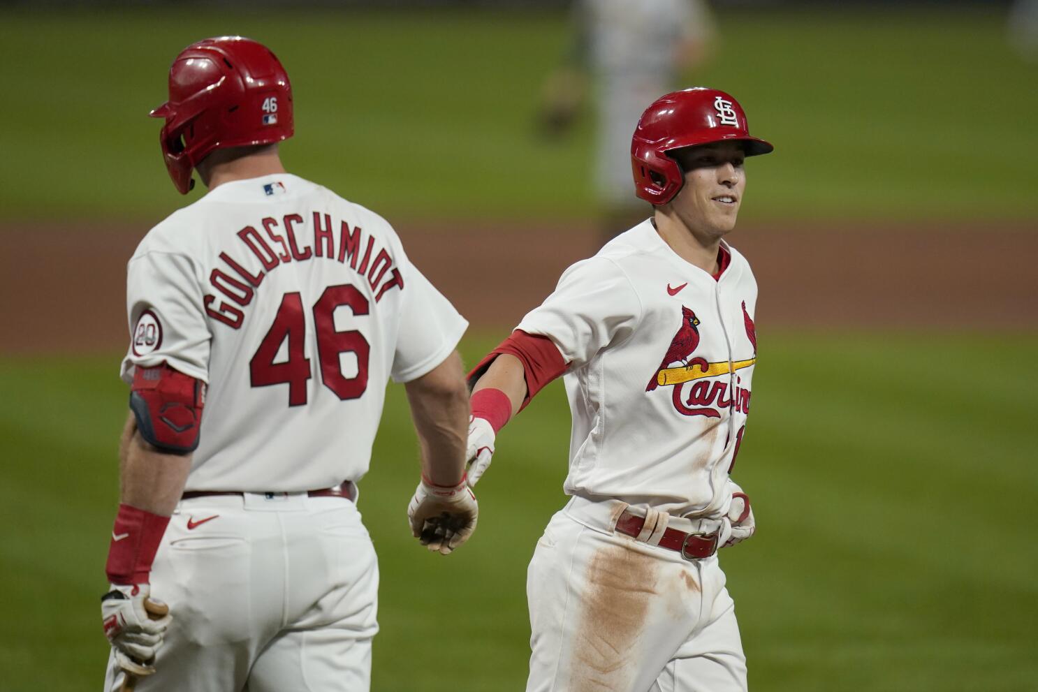 St. Louis Cardinals catcher Yadier Molina walks back to position after a  mound visit with starting pitcher Adam Wainwright in the seventh inning  against the San Francisco Giants at Busch Stadium in