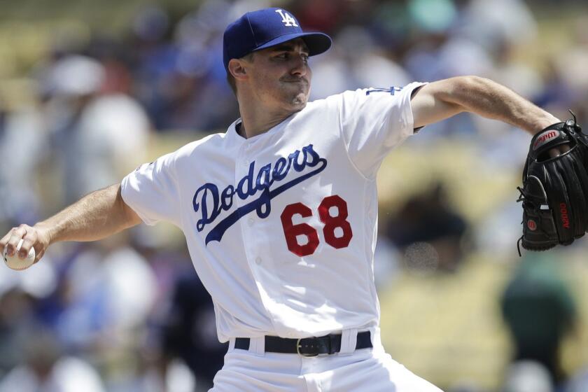 Los Angeles Dodgers starting pitcher Ross Stripling throws against the Milwaukee Brewers during the first inning of a baseball game, Sunday, April 14, 2019, in Los Angeles. (AP Photo/Jae C. Hong)