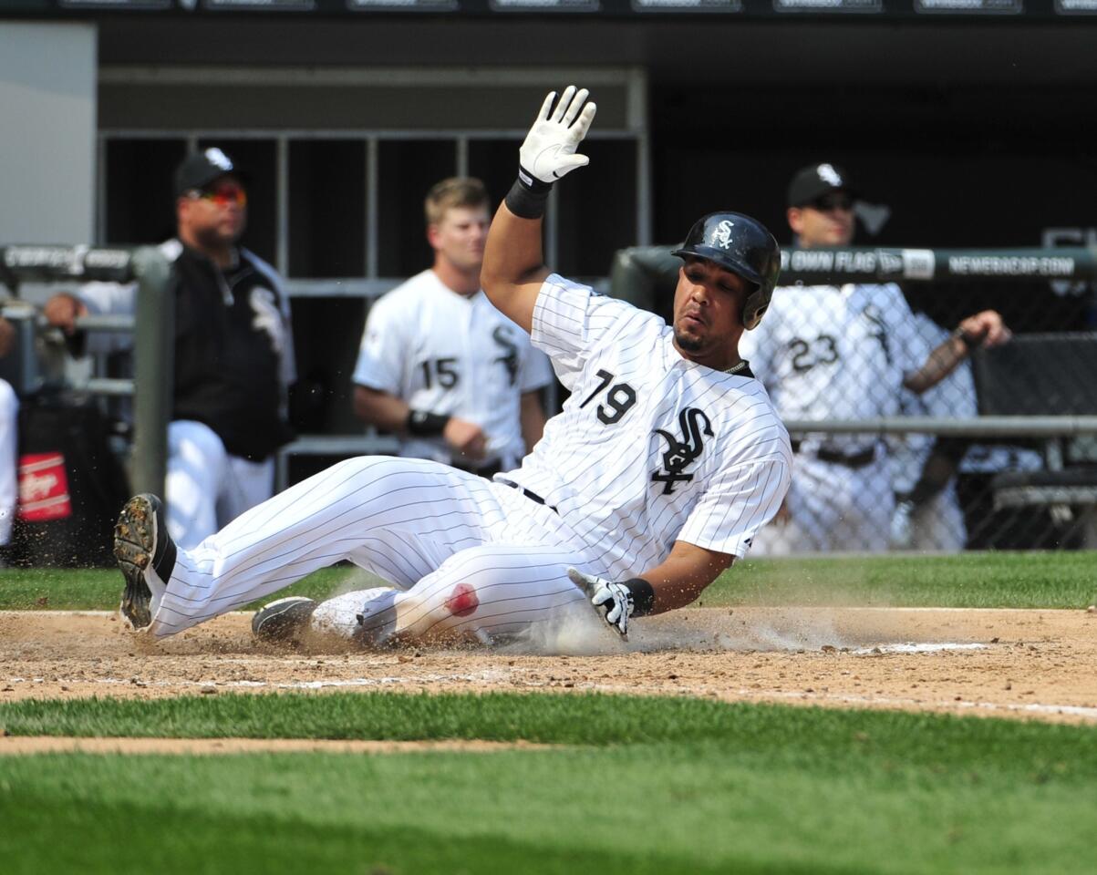 Jose Abreu scores against the Astros during the sixth inning.
