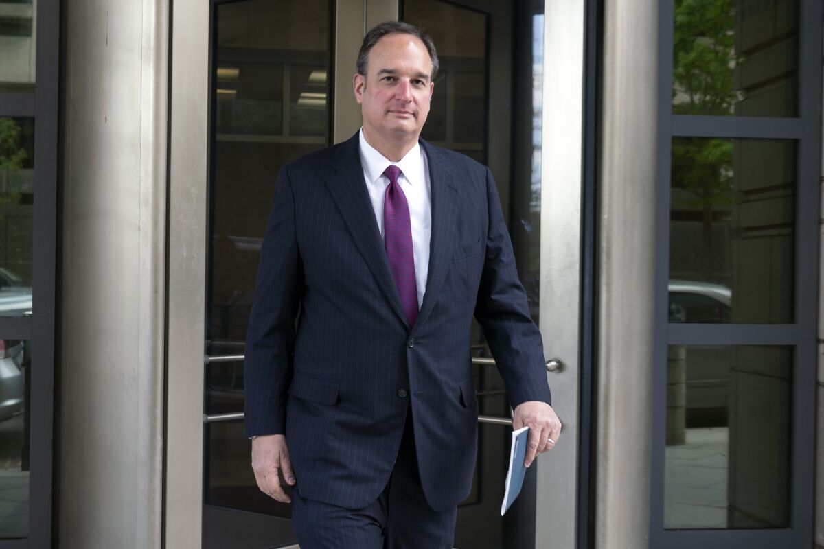 FILE - Attorney Michael Sussmann leaves federal court in Washington, April 27, 2022. A criminal case brought by special counsel John Durham, the prosecutor appointed to investigate potential government wrongdoing in the early days of the Trump-Russia probe, heads to trial in Washington's federal court on May 16. The case centers on a single false statement that Sussmann, a cybersecurity lawyer who represented the Hillary Clinton presidential campaign in 2016, is alleged to have made to the FBI during a meeting that year. (AP Photo/Jose Luis Magana, File)