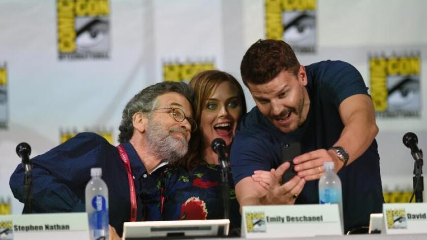 (L-R) Producer Stephen Nathan, actors Emily Deschanel and David Boreanaz attend FOX's "Bones" panel during Comic-Con International 2014 at San Diego Convention Center on July 25, 2014 in San Diego, California. (Ethan Miller / Getty Images)