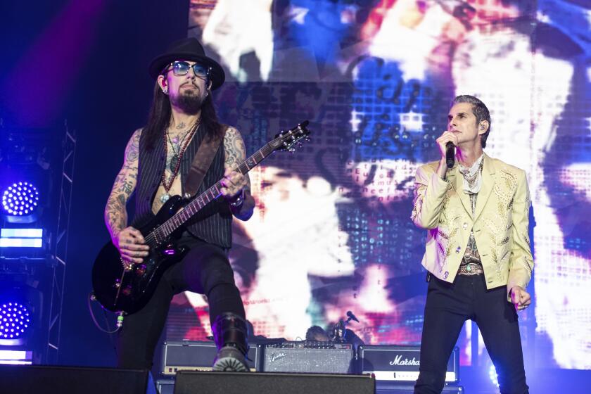 Dave Navarro, left, plays guitar and Perry Farrell of Jane's Addiction sings