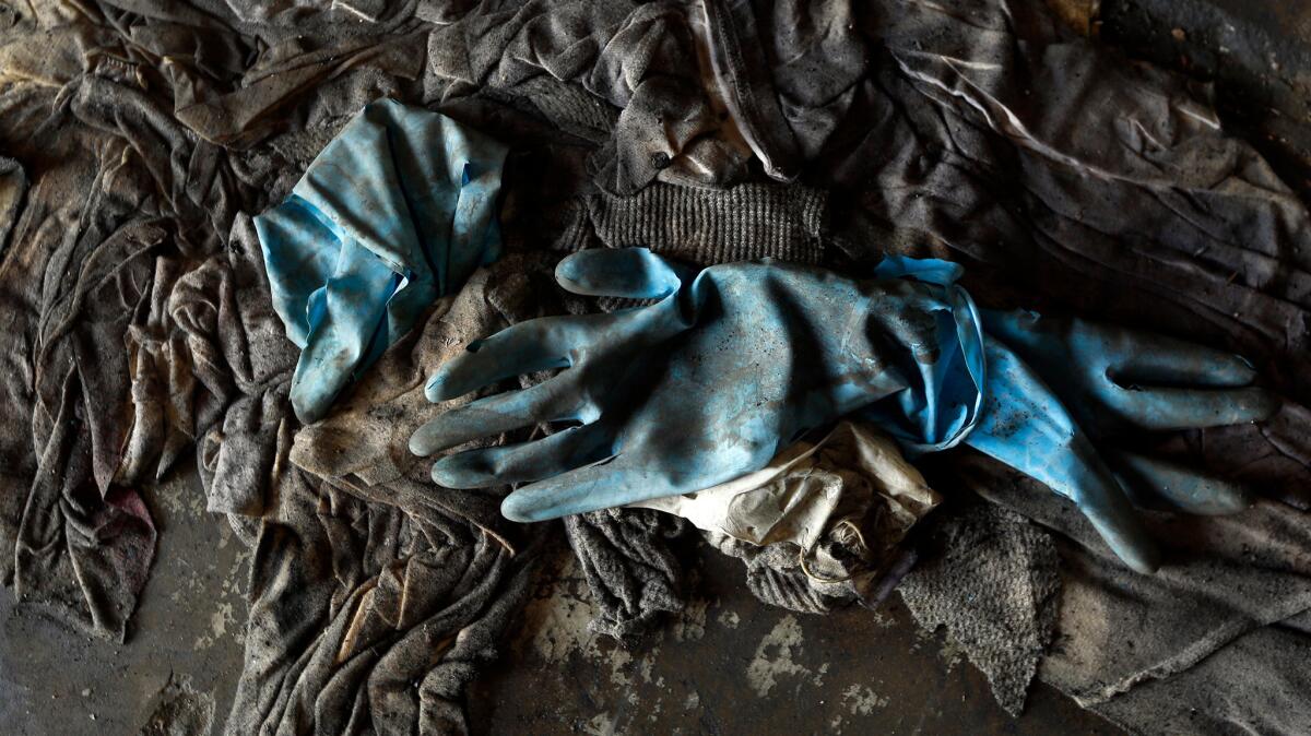Work gloves and old clothing found after the Sept. 11 attack.